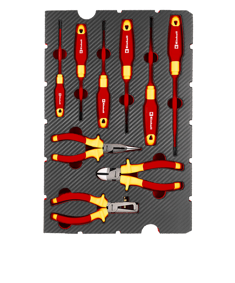 Tool pad containing insulated VDE screwdrivers and VDE pliers for electrical work. The red and yellow tools are neatly arranged in a custom-fit foam insert.