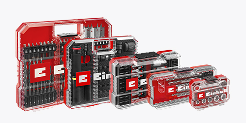 Four transparent Einhell drill and bit sets in red and black plastic cases, arranged side by side. The cases display various assortments of bits, drills, and socket attachments.